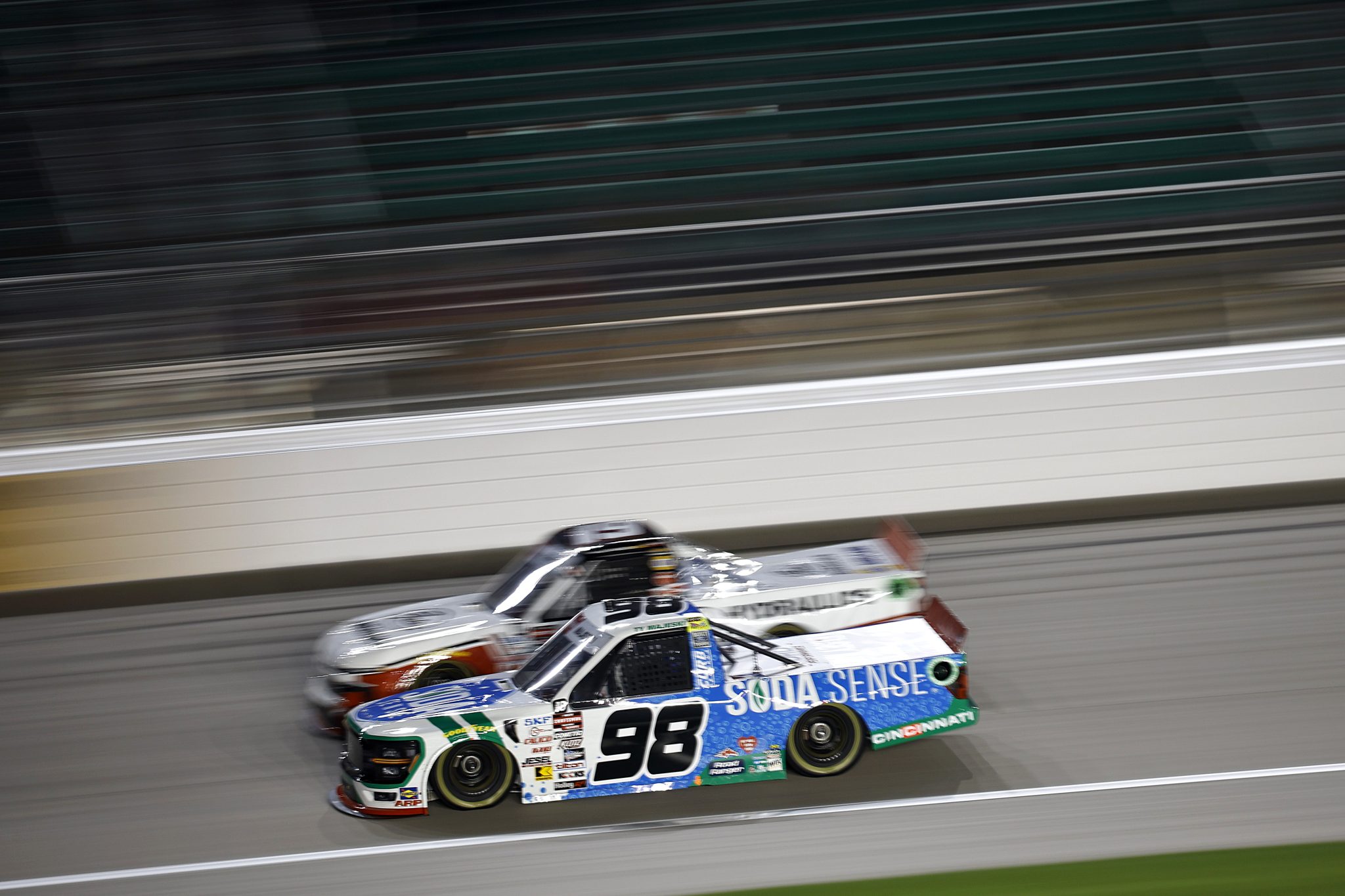 KANSAS CITY, KANSAS - SEPTEMBER 27: Ty Majeski, driver of the #98 Soda Sense/Curb Records Ford, and Christian Eckes, driver of the #19 Gates Hydraulics Chevrolet, race during the NASCAR Craftsman Truck Series Kubota Tractor 200 at Kansas Speedway on September 27, 2024 in Kansas City, Kansas. (Photo by Chris Graythen/Getty Images) | Getty Images