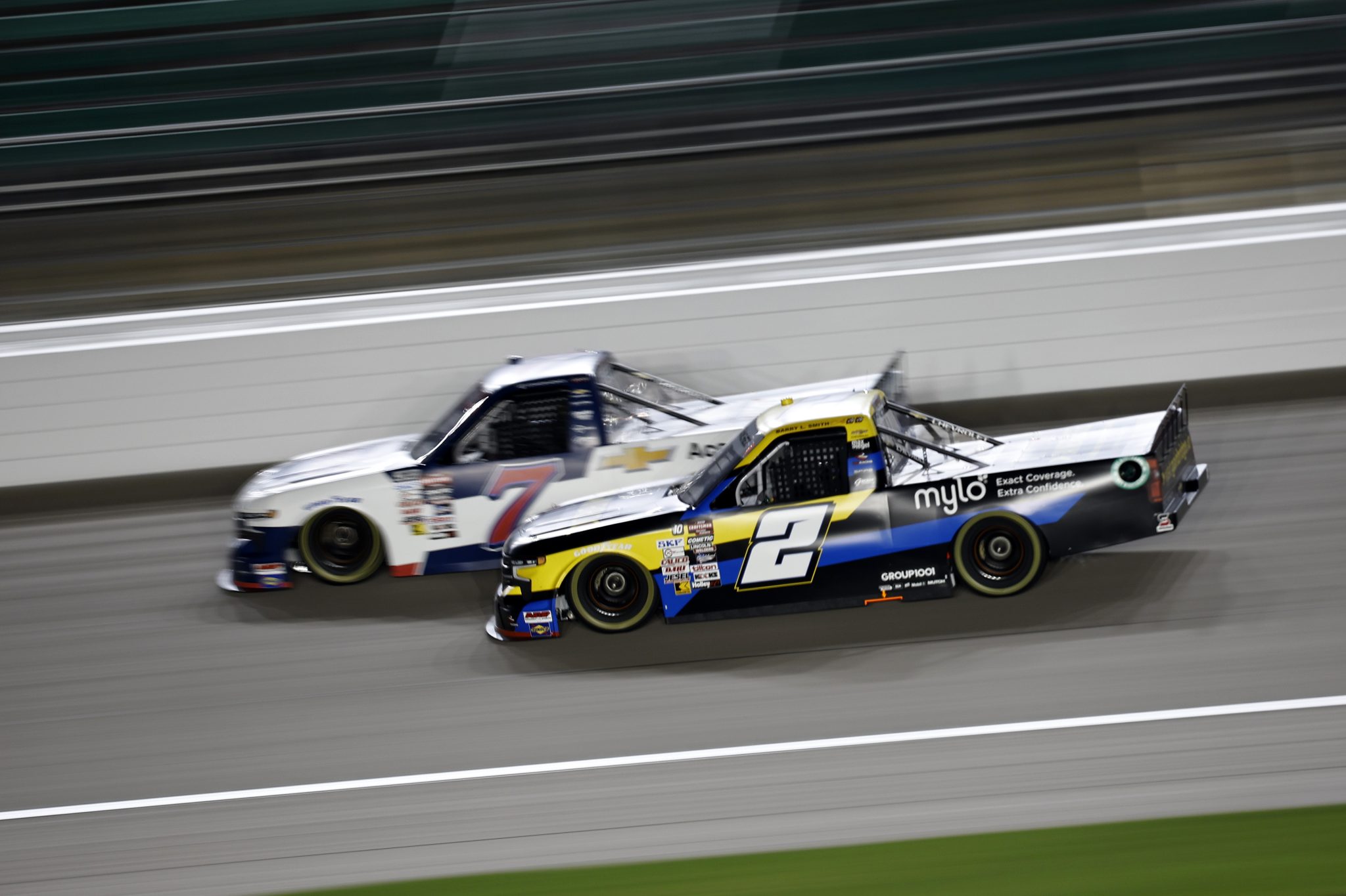 KANSAS CITY, KANSAS - SEPTEMBER 27: Nick Sanchez, driver of the #2 Gainbridge Chevrolet, and Connor Mosack, driver of the #7 MKS Pipe and Valve Chevrolet, race during the NASCAR Craftsman Truck Series Kubota Tractor 200 at Kansas Speedway on September 27, 2024 in Kansas City, Kansas. (Photo by Chris Graythen/Getty Images) | Getty Images