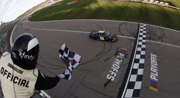 KANSAS CITY, KANSAS - SEPTEMBER 28: Aric Almirola, driver of the #20 He Gets Us Toyota, crosses the finish line to win the NASCAR Xfinity Series Kansas Lottery 300 at Kansas Speedway on September 28, 2024 in Kansas City, Kansas. (Photo by Sean Gardner/Getty Images) | Getty Images