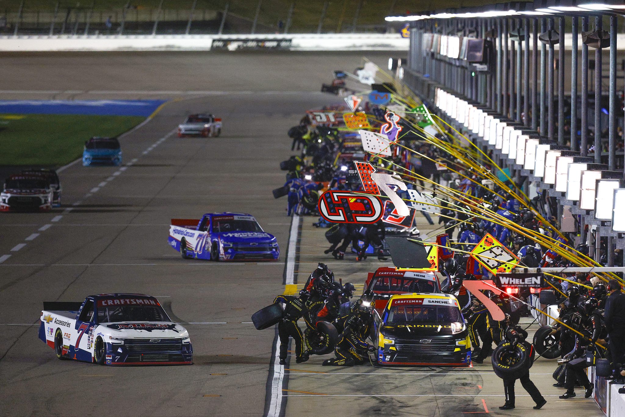 KANSAS CITY, KANSAS - SEPTEMBER 27: Connor Mosack, driver of the #7 MKS Pipe and Valve Chevrolet, and Nick Sanchez, driver of the #2 Gainbridge Chevrolet, pit during the NASCAR Craftsman Truck Series Kubota Tractor 200 at Kansas Speedway on September 27, 2024 in Kansas City, Kansas. (Photo by Sean Gardner/Getty Images) | Getty Images