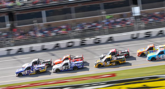 TALLADEGA, ALABAMA - SEPTEMBER 30: Christian Eckes, driver of the #19 NAPA Auto Care Chevrolet, Chandler Smith, driver of the #25 Rackley Roofing Chevrolet,  and Dean Thompson, driver of the #5 CST Industrial Toyota, race during the NASCAR Craftsman Truck Series Love's RV Stop 250 at Talladega Superspeedway on September 30, 2023 in Talladega, Alabama. (Photo by Meg Oliphant/Getty Images) | Getty Images