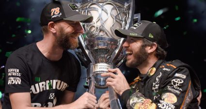 HOMESTEAD, FL - NOVEMBER 19:  Martin Truex Jr., driver of the #78 Bass Pro Shops/Tracker Boats Toyota, celebrates with crew chief Cole Pearn and the trophy in Victory Lane after winning the Monster Energy NASCAR Cup Series Championship and the Monster Energy NASCAR Cup Series Championship Ford EcoBoost 400 at Homestead-Miami Speedway on November 19, 2017 in Homestead, Florida.  (Photo by Jared C. Tilton/Getty Images) | Getty Images