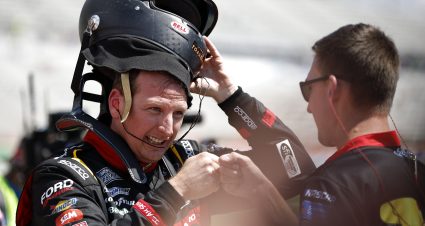 HAMPTON, GEORGIA - SEPTEMBER 07: Michael McDowell, driver of the #34 B'laster Work It Like A Pro Ford, fist bumps with a crew member after winning the pole award during qualifying for the NASCAR Cup Series Quaker State 400 Available at Walmart  at Atlanta Motor Speedway on September 07, 2024 in Hampton, Georgia. (Photo by Sean Gardner/Getty Images) | Getty Images