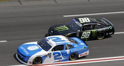HAMPTON, GEORGIA - SEPTEMBER 07: Jesse Love, driver of the #2 Samsara Chevrolet, and Riley Herbst, driver of the #98 Monster Energy Ford, race during the NASCAR Xfinity Series Focused Health 250 at Atlanta Motor Speedway on September 07, 2024 in Hampton, Georgia. (Photo by Sean Gardner/Getty Images) | Getty Images