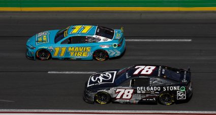 HAMPTON, GEORGIA - SEPTEMBER 08: Denny Hamlin, driver of the #11 Mavis Tire Toyota, and BJ McLeod, driver of the #78 Delgado Stone Chevrolet, race during the NASCAR Cup Series Quaker State 400 Available at Walmart at Atlanta Motor Speedway on September 08, 2024 in Hampton, Georgia. (Photo by Sean Gardner/Getty Images) | Getty Images