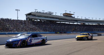 AVONDALE, ARIZONA - NOVEMBER 05: Kyle Larson, driver of the #5 HendrickCars.com Chevrolet, and Christopher Bell, driver of the #20 Rheem/DEWALT Toyota, drive during the NASCAR Cup Series Championship at Phoenix Raceway on November 05, 2023 in Avondale, Arizona. (Photo by Chris Graythen/Getty Images) | Getty Images