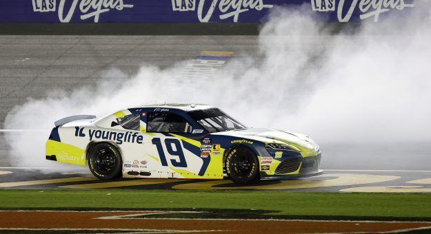 LAS VEGAS, NEVADA - OCTOBER 11: Aric Almirola, driver of the #19 Young Life Toyota, celebrates with a burnout after winning  the NASCAR Xfinity SeriesFocused Health 302 at Las Vegas Motor Speedway on October 11, 2025 in Las Vegas, Nevada. (Photo by Logan Riely/Getty Images) | Getty Images