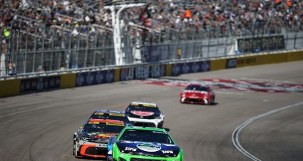 LAS VEGAS, NEVADA - OCTOBER 12: Kyle Busch, driver of the #8 zone nicotine pouches Chevrolet, and Chase Briscoe, driver of the #19 Bass Pro Shops Toyota, race during the NASCAR Cup Series South Point 400 at Las Vegas Motor Speedway on October 12, 2025 in Las Vegas, Nevada. (Photo by Chris Graythen/Getty Images) | Getty Images