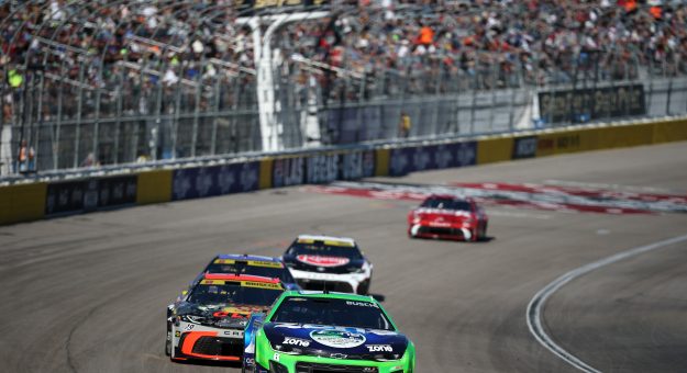 LAS VEGAS, NEVADA - OCTOBER 12: Kyle Busch, driver of the #8 zone nicotine pouches Chevrolet, and Chase Briscoe, driver of the #19 Bass Pro Shops Toyota, race during the NASCAR Cup Series South Point 400 at Las Vegas Motor Speedway on October 12, 2025 in Las Vegas, Nevada. (Photo by Chris Graythen/Getty Images) | Getty Images