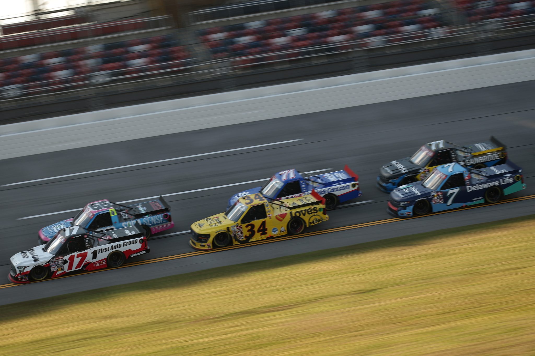 TALLADEGA, ALABAMA - OCTOBER 17: Giovanni Ruggiero, driver of the #17 First Auto Group Toyota, Luke Fenhaus, driver of the #66 Soda Sense Ford, Layne Riggs, driver of the #34 Love's RV STOP Ford, and Rajah Caruth, driver of the #71 HendrickCars.com Chevrolet, race during the NASCAR Craftsman Truck Series Love's RV Stop 225 at Talladega Superspeedway on October 17, 2025 in Talladega, Alabama. (Photo by Chris Graythen/Getty Images) | Getty Images