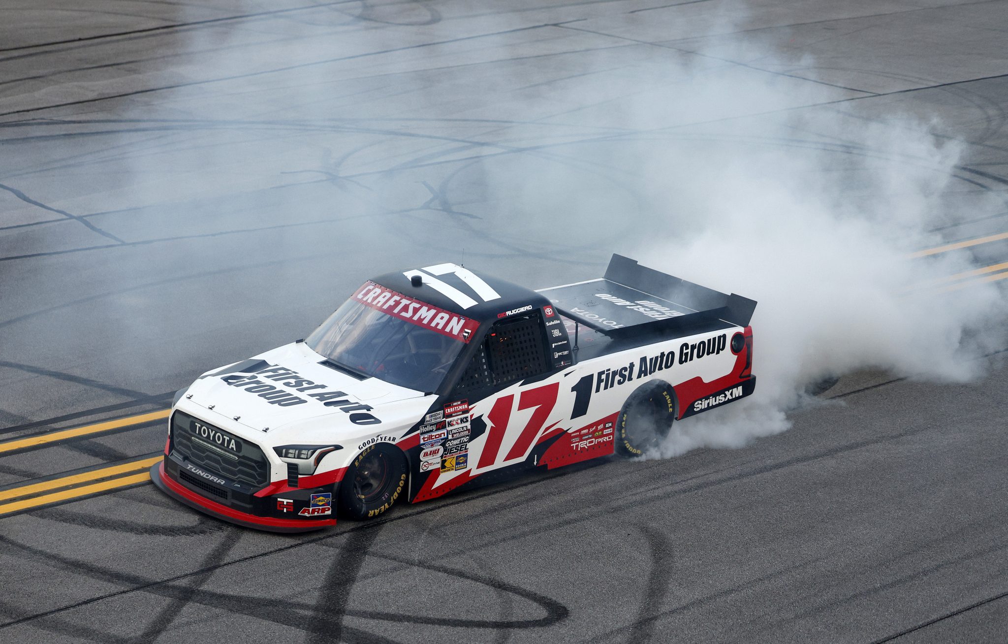 TALLADEGA, ALABAMA - OCTOBER 17: Giovanni Ruggiero, driver of the #17 First Auto Group Toyota, celebrates with a burnout after winning the NASCAR Craftsman Truck Series Love's RV Stop 225 at Talladega Superspeedway on October 17, 2025 in Talladega, Alabama. (Photo by Sean Gardner/Getty Images) | Getty Images