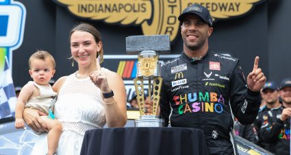 INDIANAPOLIS, INDIANA - JULY 27: Bubba Wallace, driver of the #23 Chumba Casino Toyota, poses with his wife, Amanda Wallace and son, Becks Hayden Wallace in victory lane after winning the NASCAR Cup Series Brickyard 400 Presented by PPG at Indianapolis Motor Speedway on July 27, 2025 in Indianapolis, Indiana. (Photo by Justin Casterline/Getty Images) | Getty Images
