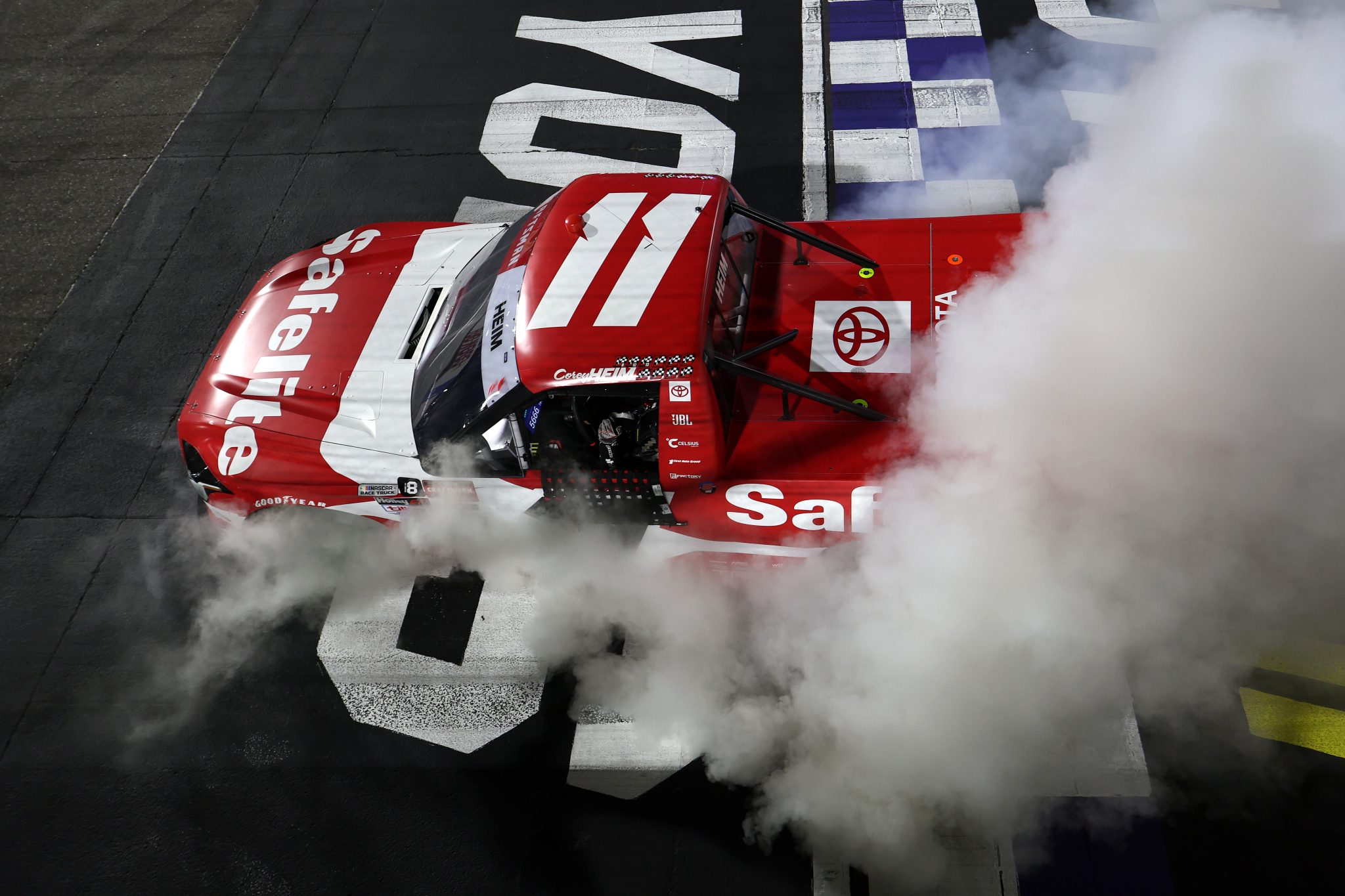 MARTINSVILLE, VIRGINIA - OCTOBER 24: Corey Heim, driver of the #11 Safelite Toyota, celebrates with a burnout after winning the NASCAR Craftsman Truck Slim Jim 200 at Martinsville Speedway on October 24, 2025 in Martinsville, Virginia. (Photo by David Jensen/Getty Images) | Getty Images