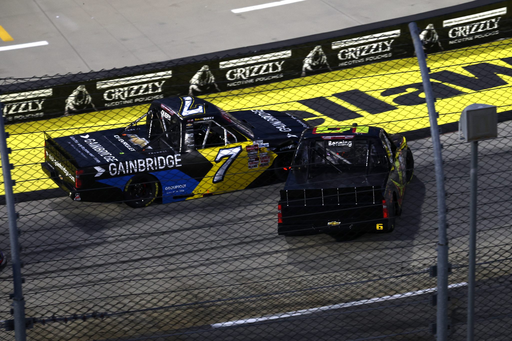 MARTINSVILLE, VIRGINIA - OCTOBER 24: Norm Benning, driver of the #6 MDIA INC Chevrolet, and Brenden Queen, driver of the #7 Gainbridge Chevrolet, spin after an on-track incident during the NASCAR Craftsman Truck Slim Jim 200 at Martinsville Speedway on October 24, 2025 in Martinsville, Virginia. (Photo by Jared C. Tilton/Getty Images) | Getty Images