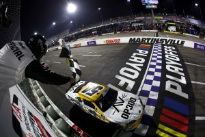 MARTINSVILLE, VIRGINIA - OCTOBER 25: Taylor Gray, driver of the #54 Operation 300 Toyota, takes the checkered flag to win the NASCAR Xfinity Series IAA and Ritchie Bros. 250 at Martinsville Speedway on October 25, 2025 in Martinsville, Virginia. (Photo by Jared C. Tilton/Getty Images) | Getty Images