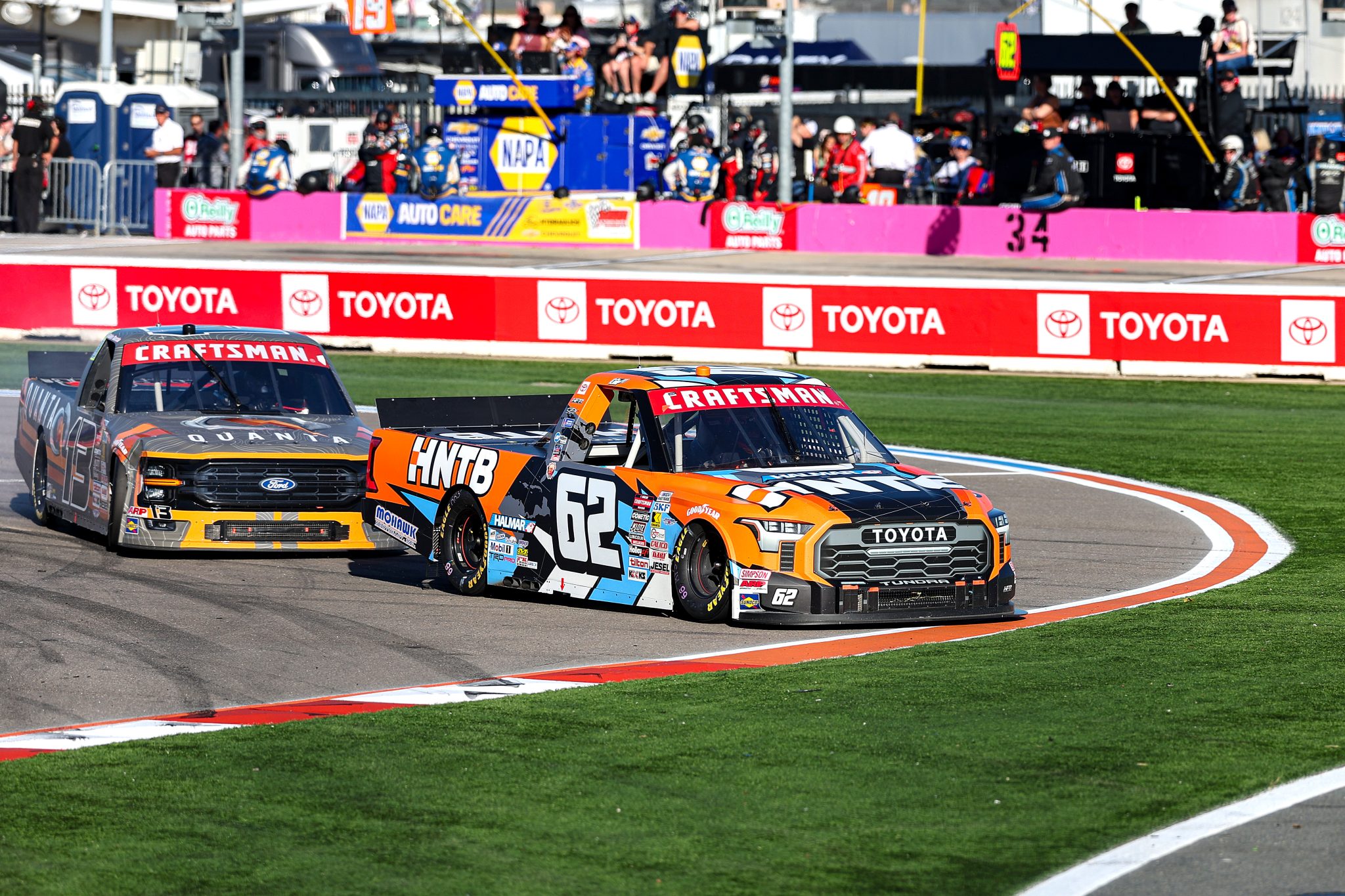 CONCORD, NORTH CAROLINA - OCTOBER 03: Wesley Slimp, driver of the #62 HNTB Toyota, and Jake Garcia, driver of the #13 Quanta Services Ford, spin after an on-track incident during the NASCAR Craftsman Truck Series EcoSave 250 at Charlotte Motor Speedway on October 03, 2025 in Concord, North Carolina. (Photo by David Jensen/Getty Images) | Getty Images