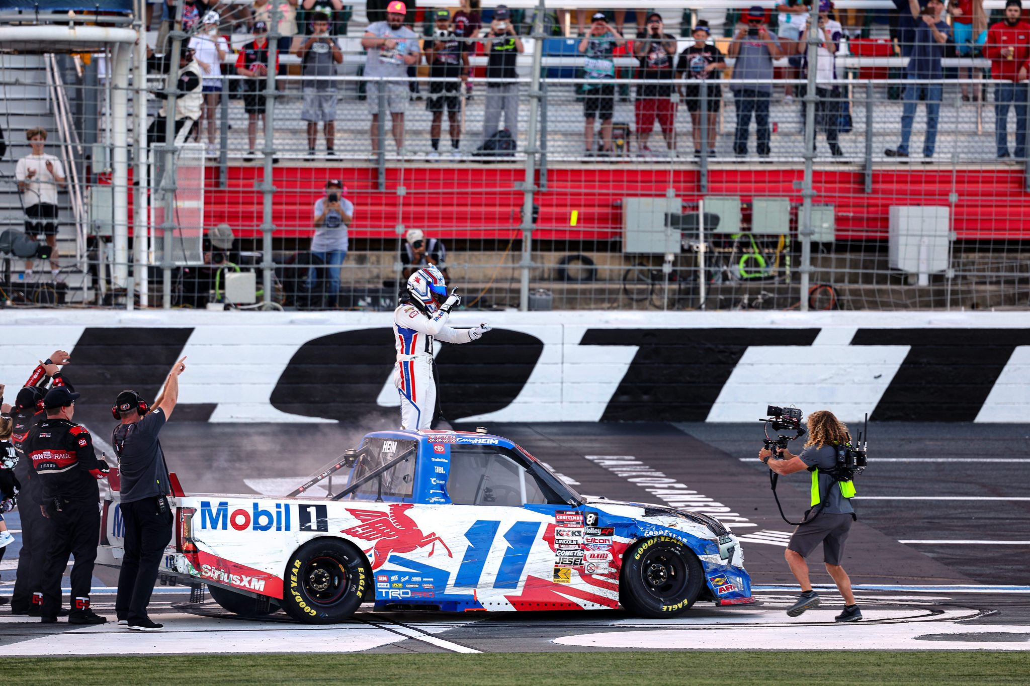 CONCORD, NORTH CAROLINA - OCTOBER 03: Corey Heim, driver of the #11 Mobil 1 Toyota, celebrates after winning the NASCAR Craftsman Truck Series EcoSave 250 at Charlotte Motor Speedway on October 03, 2025 in Concord, North Carolina. (Photo by David Jensen/Getty Images) | Getty Images