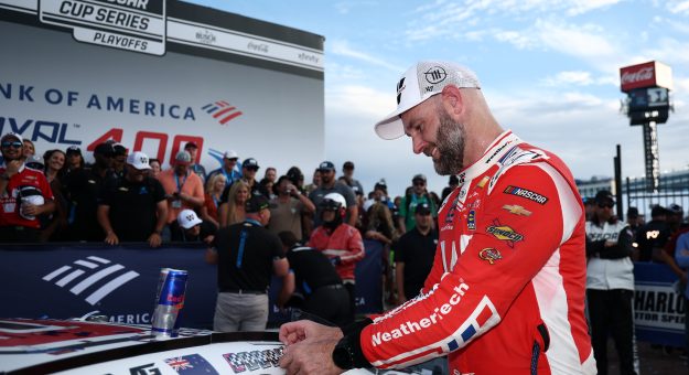 CONCORD, NORTH CAROLINA - OCTOBER 05: Shane Van Gisbergen, driver of the #88 WeatherTech Chevrolet, places the winner sticker on his car in victory lane after winning the NASCAR Cup Series Bank of America ROVAL 400 at Charlotte Motor Speedway on October 05, 2025 in Concord, North Carolina. (Photo by Jared C. Tilton/Getty Images) | Getty Images