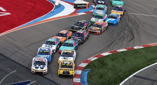 CONCORD, NORTH CAROLINA - OCTOBER 05: Shane Van Gisbergen, driver of the #88 WeatherTech Chevrolet, and Christopher Bell, driver of the #20 DEWALT Toyota, lead the field during the NASCAR Cup Series Bank of America ROVAL 400 at Charlotte Motor Speedway on October 05, 2025 in Concord, North Carolina. (Photo by David Jensen/Getty Images) | Getty Images
