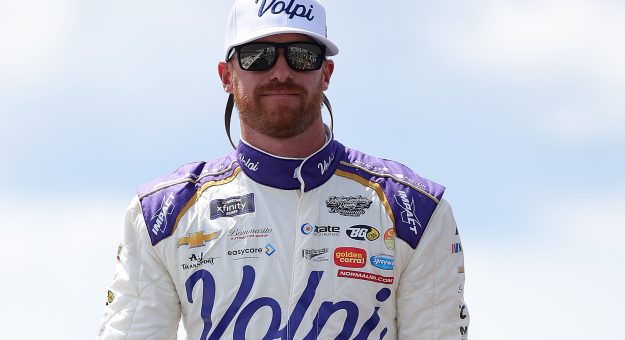 LONG POND, PENNSYLVANIA - JUNE 21: Jeb Burton, driver of the #27 Volpi Foods Chevrolet, walks onstage during driver intros prior to the NASCAR Xfinity Series Explore the Pocono Mountains 250 at Pocono Raceway on June 21, 2025 in Long Pond, Pennsylvania. (Photo by Jonathan Bachman/Getty Images) | Getty Images
