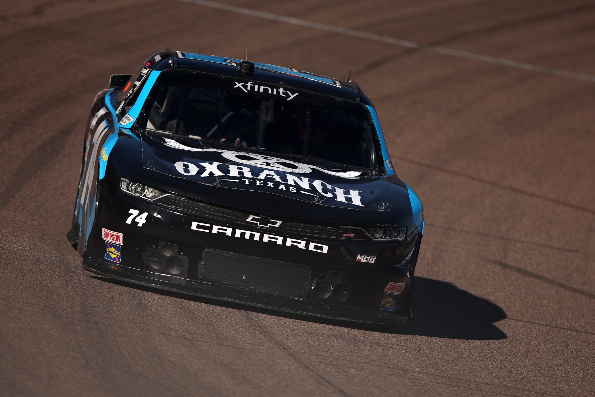 AVONDALE, ARIZONA - NOVEMBER 01: Dawson Cram, driver of the #74 Ox Ranch Texas Chevrolet, drives during qualifying for the NASCAR Xfinity Series Championship at Phoenix Raceway on November 01, 2025 in Avondale, Arizona. (Photo by James Gilbert/Getty Images) | Getty Images