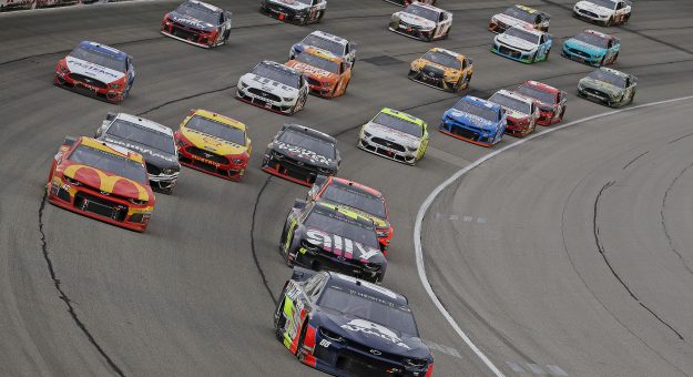 JOLIET, ILLINOIS - JUNE 30: Alex Bowman, driver of the #88 Axalta Chevrolet, leads the pack out of turn four following a restart during the Monster Energy NASCAR Cup Series Camping World 400 at Chicagoland Speedway on June 30, 2019 in Joliet, Illinois. (Photo by Jonathan Daniel/Getty Images) | Getty Images