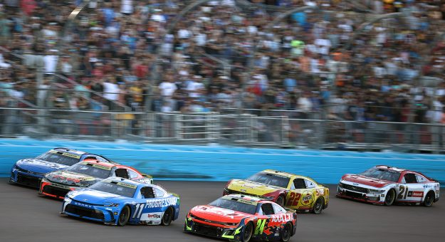 AVONDALE, ARIZONA - NOVEMBER 02: William Byron, driver of the #24 Axalta Chevrolet, Denny Hamlin, driver of the #11 Progressive Toyota, Chase Briscoe, driver of the #19 Bass Pro Shops Toyota, and Kyle Larson, driver of the #5 HendrickCars.com Chevrolet, race during the NASCAR Cup Series Championship at Phoenix Raceway on November 02, 2025 in Avondale, Arizona. (Photo by Jared C. Tilton/Getty Images) | Getty Images
