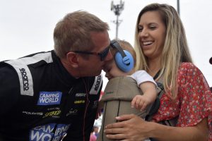 SLINGER, WISCONSIN - JULY 10: Greg Biffle #69 kisses his son before climbing into his car during the Camping World Superstar Racing Experience event at Slinger Speedway on July 10, 2021 in Slinger, Wisconsin. (Photo by Logan Riely/SRX via Getty Images)