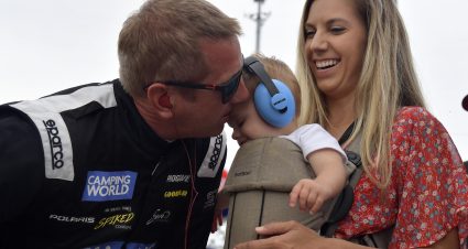 SLINGER, WISCONSIN - JULY 10: Greg Biffle #69 kisses his son before climbing into his car during the Camping World Superstar Racing Experience event at Slinger Speedway on July 10, 2021 in Slinger, Wisconsin. (Photo by Logan Riely/SRX via Getty Images)