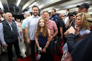 CONCORD, NORTH CAROLINA - OCTOBER 13: Republican vice presidential nominee, U.S. Sen. J.D. Vance (R-OH) (L) poses with Honorary Starter, former NASCAR Cup Series driver, Greg Biffle and his daughter Emma Elizabeth Biffle during the drivers meeting prior to the NASCAR Cup Series Bank of America ROVAL 400 at Charlotte Motor Speedway on October 13, 2024 in Concord, North Carolina. (Photo by Meg Oliphant/Getty Images) | Getty Images