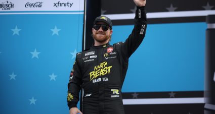 DAYTONA BEACH, FLORIDA - FEBRUARY 16: Tyler Reddick, driver of the #45 Nasty Beast Toyota waves to fans as he walks onstage during driver intros prior to the NASCAR Cup Series Daytona 500 at Daytona International Speedway on February 16, 2025 in Daytona Beach, Florida. (Photo by James Gilbert/Getty Images) | Getty Images
