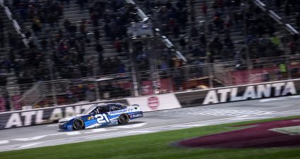 HAMPTON, GEORGIA - FEBRUARY 22: Austin Hill, driver of the #21 Bennett Transportation Chevrolet, crosses the finish line to win the NASCAR Xfinity Series Bennett Transportation and Logistics 250 at Atlanta Motor Speedway on February 22, 2025 in Hampton, Georgia. (Photo by Chris Graythen/Getty Images) | Getty Images