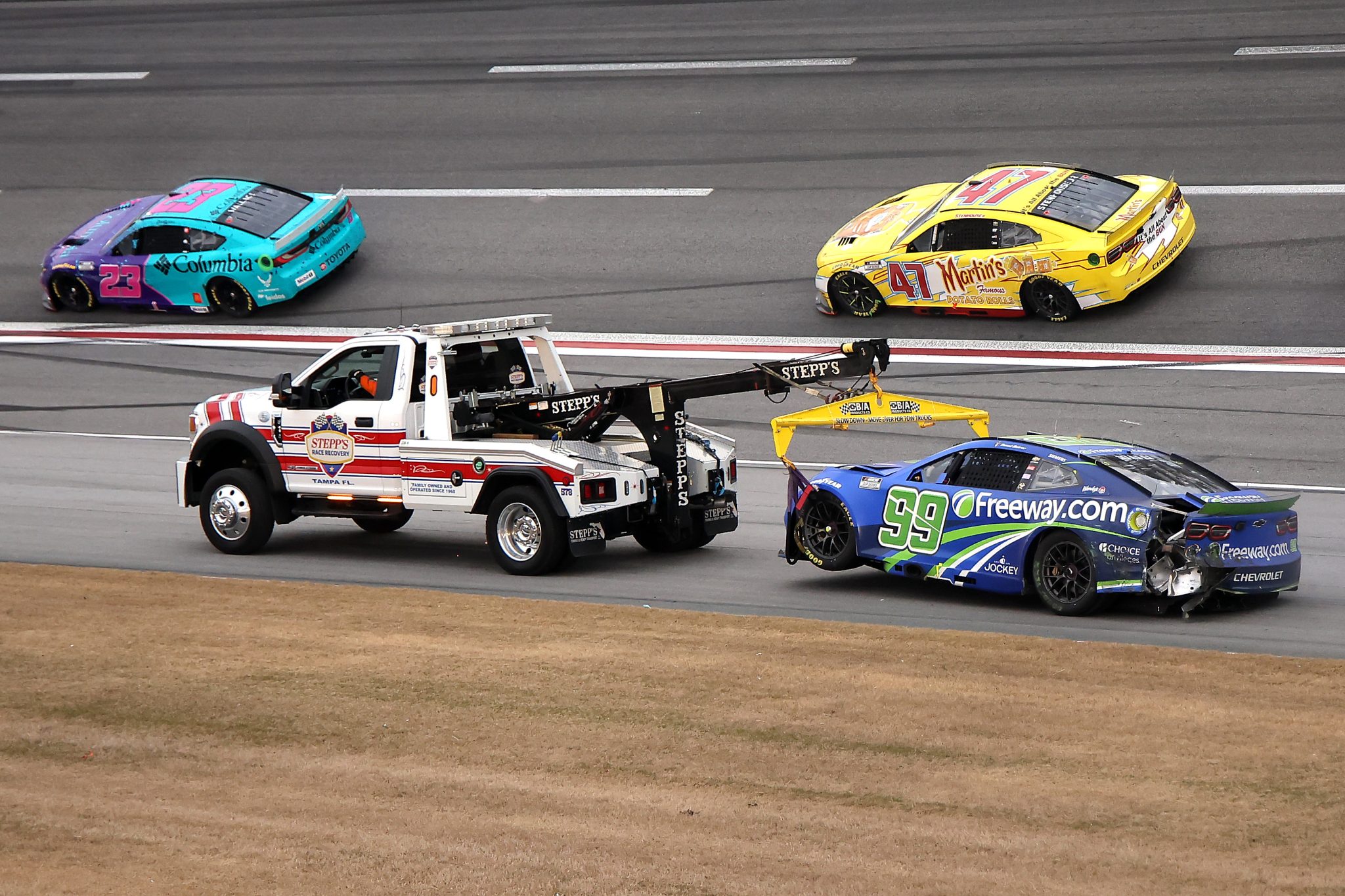 HAMPTON, GEORGIA - FEBRUARY 23: The #99 Freeway Insurance Chevrolet, driven by Daniel Suarez is towed after an on-track incident during the NASCAR Cup Series Ambetter Health 400 at Atlanta Motor Speedway on February 23, 2025 in Hampton, Georgia. (Photo by Jonathan Bachman/Getty Images) | Getty Images
