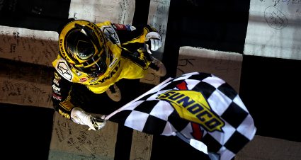 HAMPTON, GEORGIA - FEBRUARY 23: Christopher Bell, driver of the #20 DEWALT Toyota, celebrates with the checkered flag after winning the NASCAR Cup Series Ambetter Health 400 at Atlanta Motor Speedway on February 23, 2025 in Hampton, Georgia. (Photo by Chris Graythen/Getty Images) | Getty Images