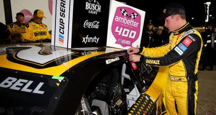 HAMPTON, GEORGIA - FEBRUARY 23: Christopher Bell, driver of the #20 DEWALT Toyota, places the winner sticker on his car in victory lane after winning the NASCAR Cup Series Ambetter Health 400 at Atlanta Motor Speedway on February 23, 2025 in Hampton, Georgia. (Photo by Jonathan Bachman/Getty Images) | Getty Images