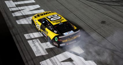 HAMPTON, GEORGIA - FEBRUARY 23: Christopher Bell, driver of the #20 DEWALT Toyota, celebrates with a burnout after winning the NASCAR Cup Series Ambetter Health 400 at Atlanta Motor Speedway on February 23, 2025 in Hampton, Georgia. (Photo by Chris Graythen/Getty Images) | Getty Images