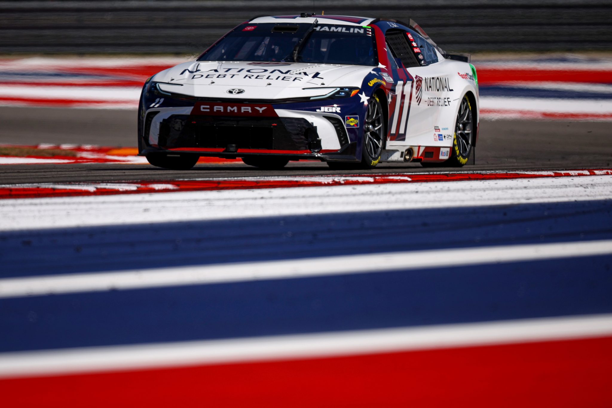 AUSTIN, TEXAS - MARCH 01: Denny Hamlin, driver of the #11 National Debt Relief Toyota, drives during qualifying for the NASCAR Cup Series EchoPark Automotive Grand Prix at Circuit of The Americas on March 01, 2025 in Austin, Texas. (Photo by James Gilbert/Getty Images) | Getty Images