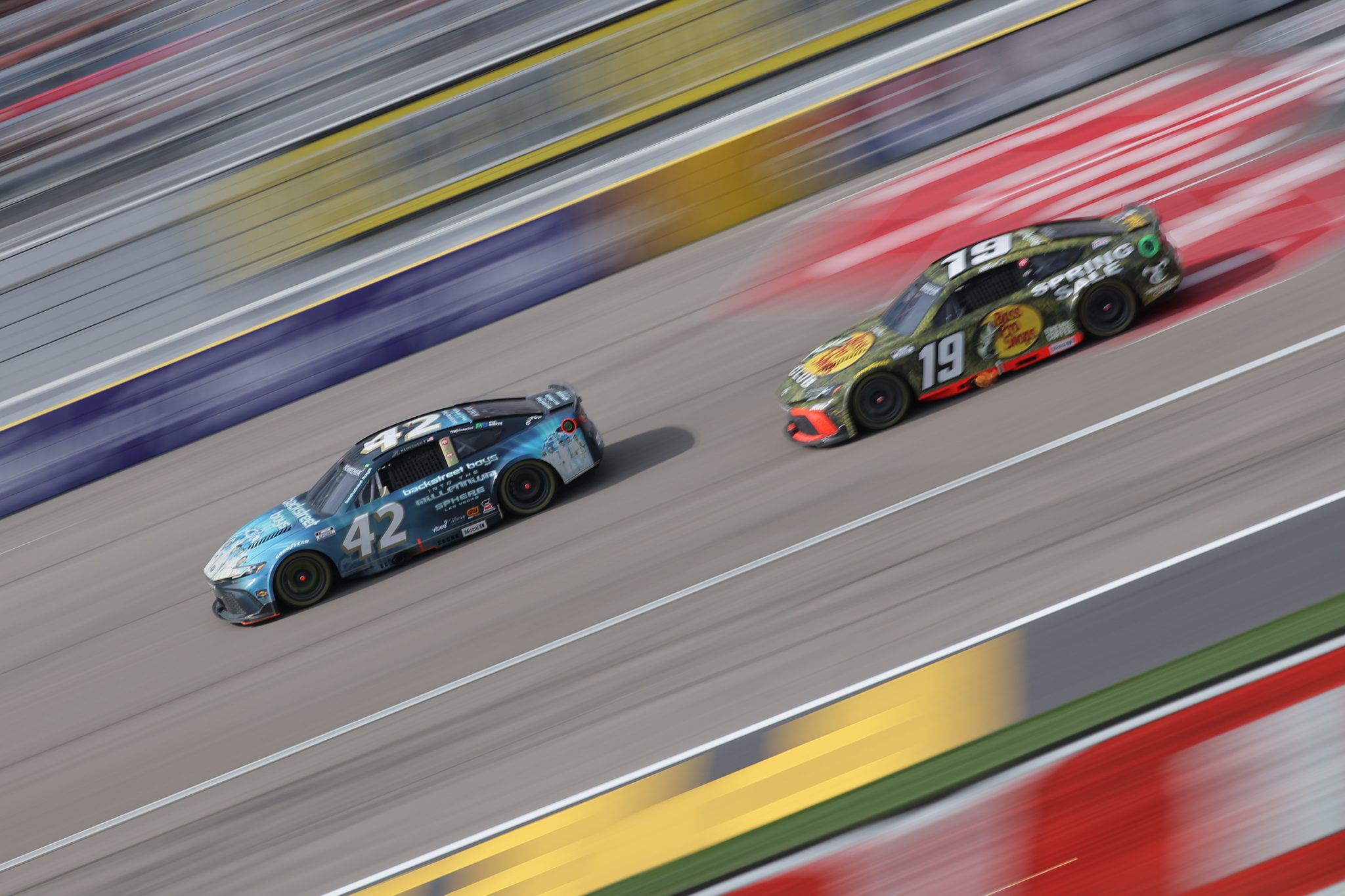 LAS VEGAS, NEVADA - MARCH 16: John Hunter Nemechek, driver of the #42 Backstreet Boys Toyota, races Chase Briscoe, driver of the #19 Bass Pro Shops Spring Fishing Classic Toyota, during the NASCAR Cup Series Pennzoil 400 at Las Vegas Motor Speedway on March 16, 2025 in Las Vegas, Nevada. (Photo by Jonathan Bachman/Getty Images) | Getty Images