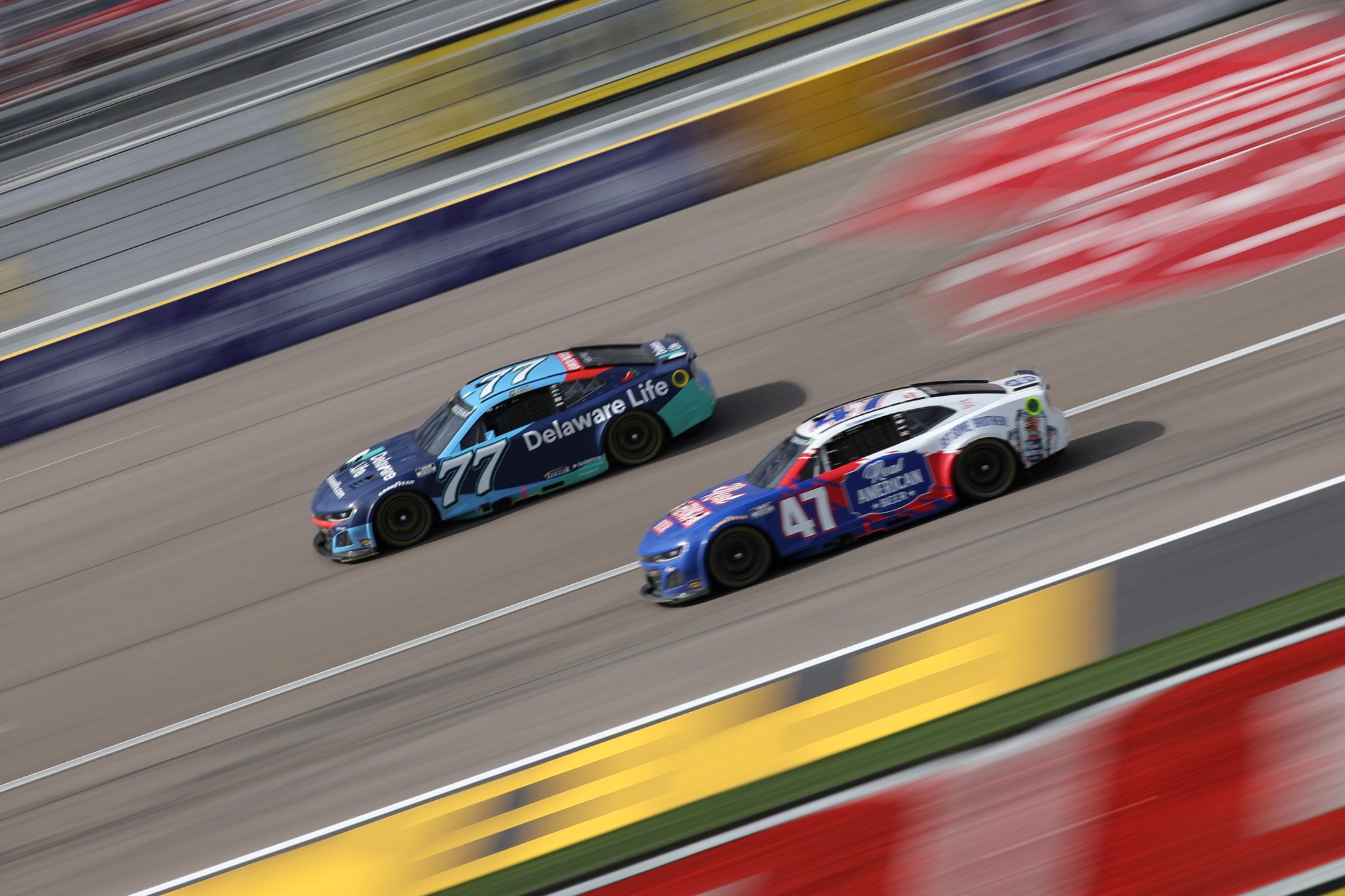 LAS VEGAS, NEVADA - MARCH 16: Carson Hocevar, driver of the #77 Delaware Life Chevrolet, races Ricky Stenhouse Jr., driver of the #47 Real American Beer Chevrolet, during the NASCAR Cup Series Pennzoil 400 at Las Vegas Motor Speedway on March 16, 2025 in Las Vegas, Nevada. (Photo by Jonathan Bachman/Getty Images) | Getty Images