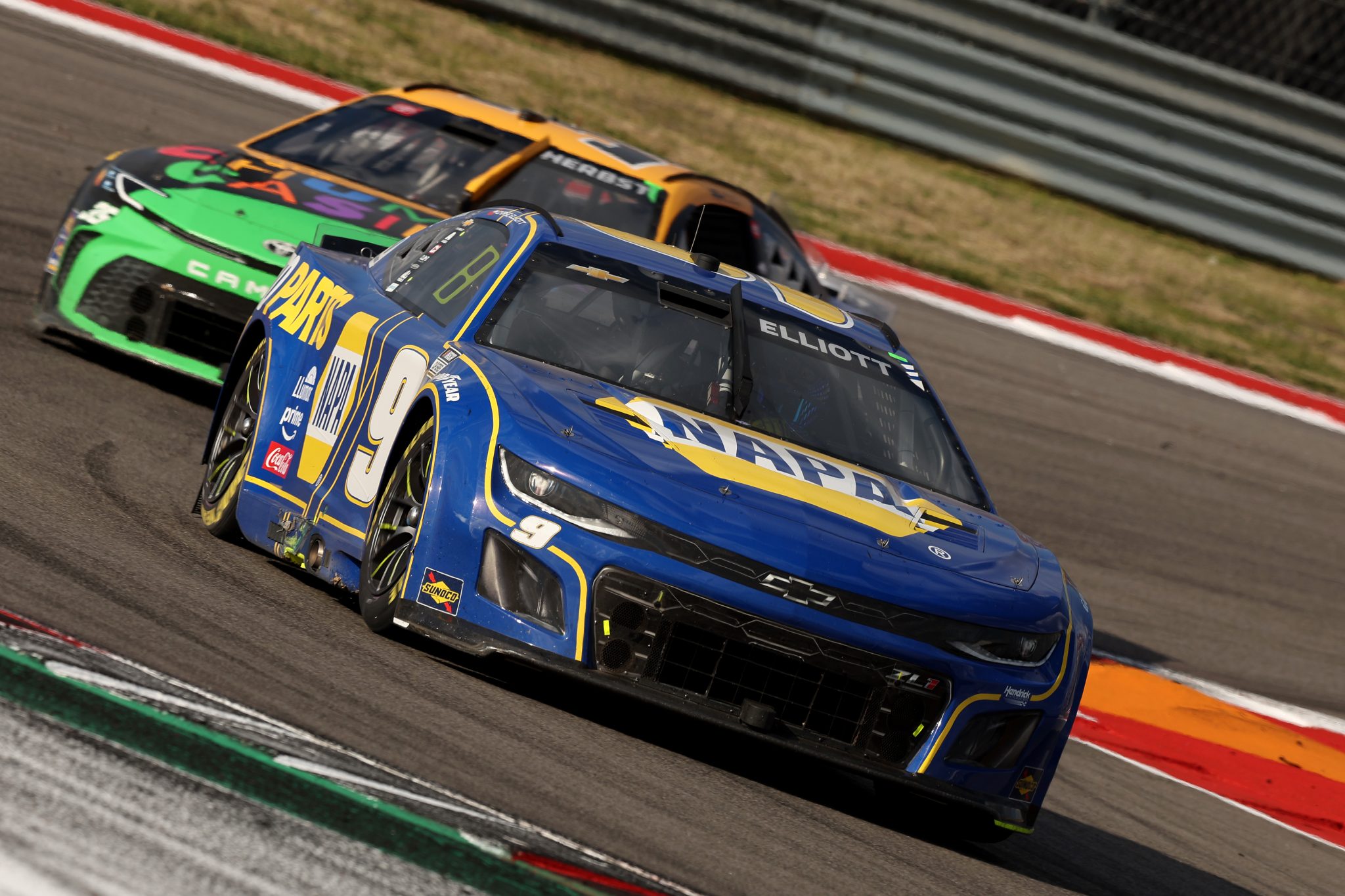 AUSTIN, TEXAS - MARCH 02: Chase Elliott, driver of the #9 NAPA Auto Parts Chevrolet, and Riley Herbst, driver of the #35 Chumba Casino Toyota, race during the NASCAR Cup Series EchoPark Automotive Grand Prix at Circuit of The Americas on March 02, 2025 in Austin, Texas. (Photo by Meg Oliphant/Getty Images) | Getty Images