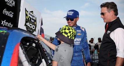 HOMESTEAD, FLORIDA - MARCH 23: Jeff Gordon, Vice Chairman of Hendrick Motorsports (R) and Kyle Larson, driver of the #5 HendrickCars.com Chevrolet, look on as Larson's son, Owen Larson places the with the winner sticker on his car in victory lane after winning  the NASCAR Cup Series Straight Talk Wireless 400 at Homestead-Miami Speedway on March 23, 2025 in Homestead, Florida. (Photo by James Gilbert/Getty Images) | Getty Images