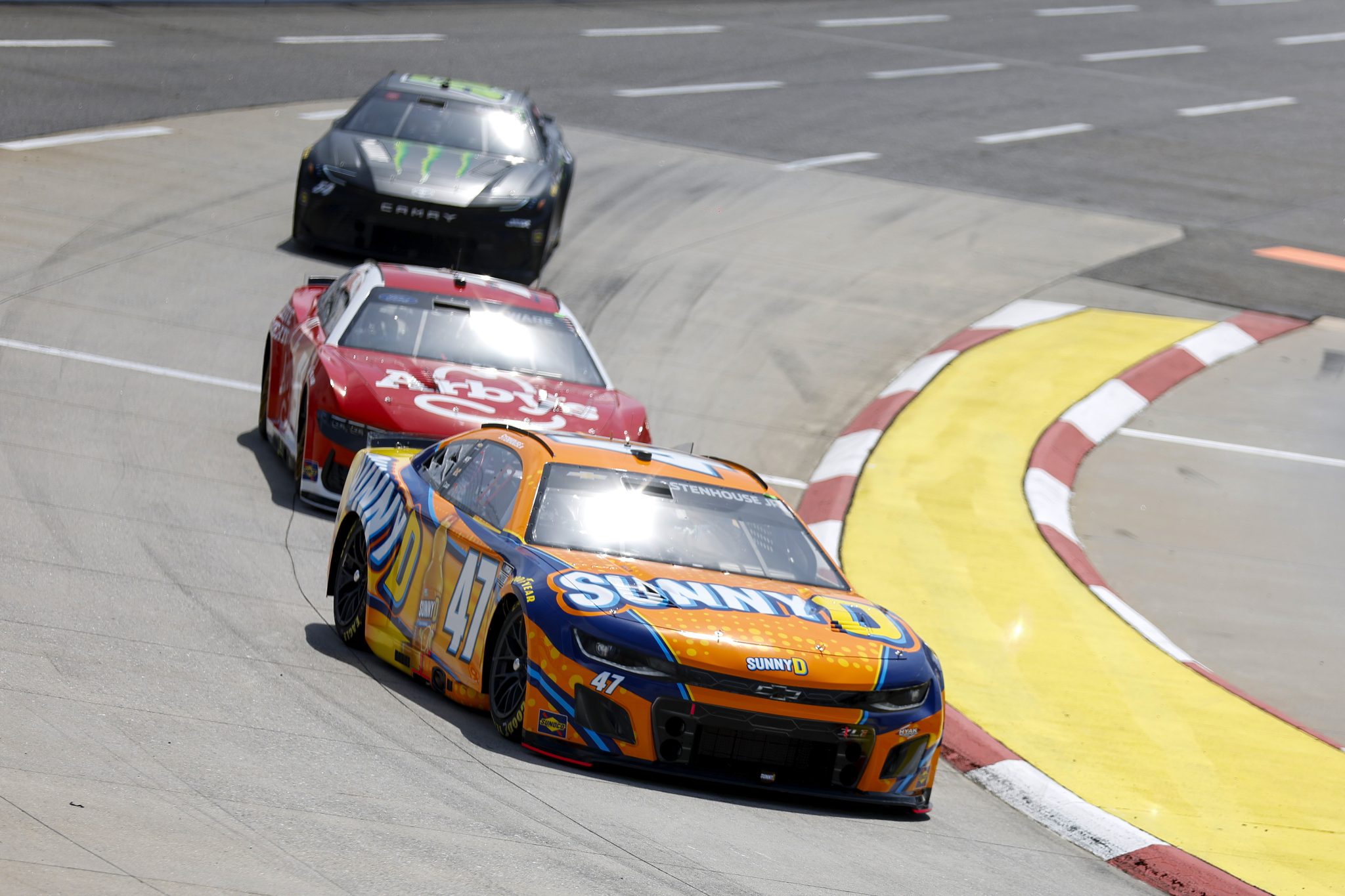 MARTINSVILLE, VIRGINIA - MARCH 29: Ricky Stenhouse Jr., driver of the #47 SUNNYD Chevrolet, Cody Ware, driver of the #51 Arby's Ford, and Ty Gibbs, driver of the #54 Monster Energy Toyota, drive during practice for the NASCAR Cup Series Cook Out 400 at Martinsville Speedway on March 29, 2025 in Martinsville, Virginia. (Photo by Logan Riely/Getty Images) | Getty Images