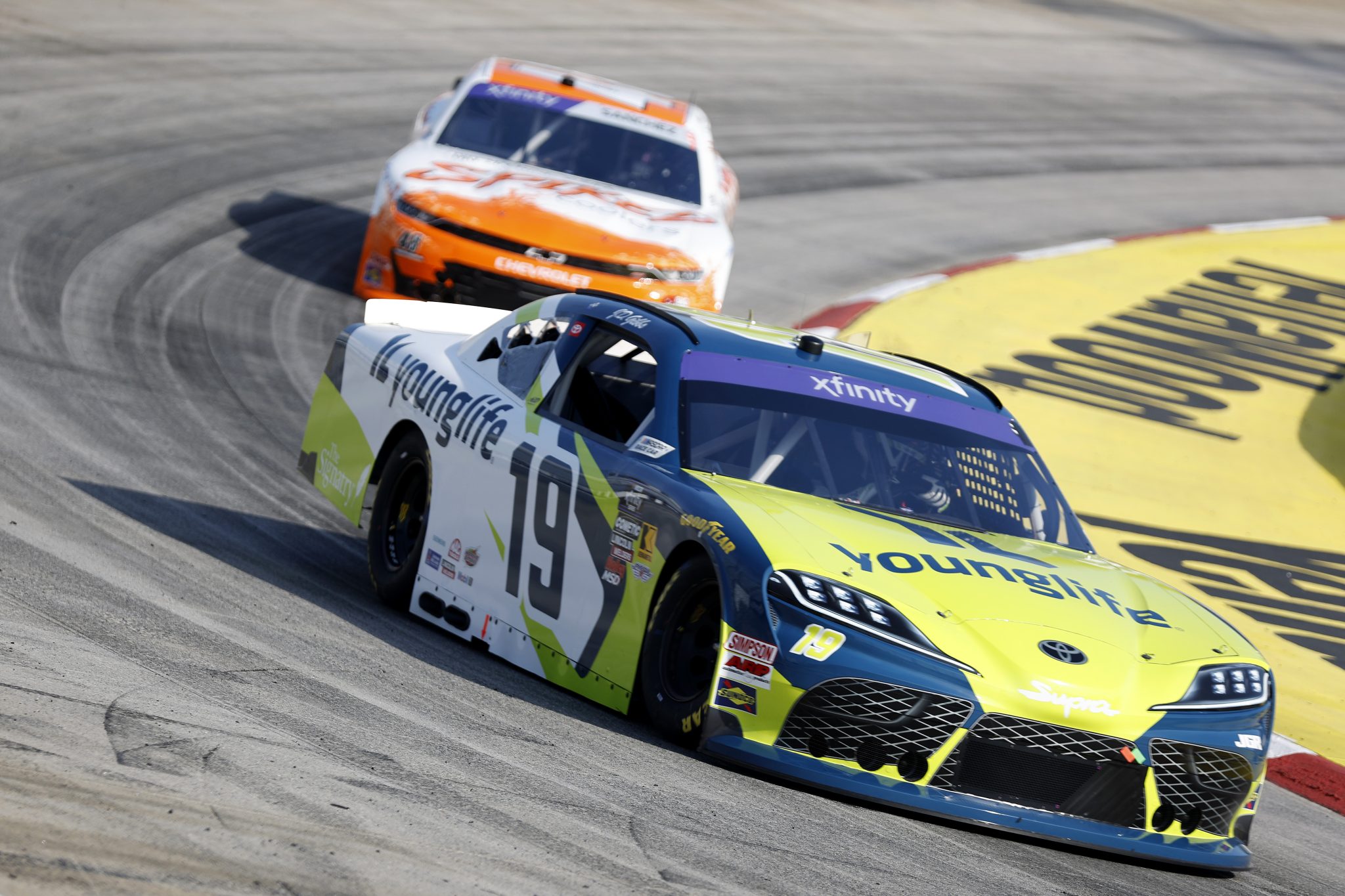 MARTINSVILLE, VIRGINIA - MARCH 28: Aric Almirola, driver of the #19 Young Life Toyota, and Nick Sanchez, driver of the #48 Big Machine Vodka Spiked Coolers Chevrolet, drive during practice for the NASCAR Xfinity Series US Marine Corps 250 at Martinsville Speedway on March 28, 2025 in Martinsville, Virginia. (Photo by Logan Riely/Getty Images) | Getty Images