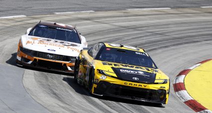 MARTINSVILLE, VIRGINIA - MARCH 29: Christopher Bell, driver of the #20 DEWALT Outdoors Toyota, and Noah Gragson, driver of the #4 A&W Root Beer Ford, ddduring practice for the NASCAR Cup Series Cook Out 400 at Martinsville Speedway on March 29, 2025 in Martinsville, Virginia. (Photo by Logan Riely/Getty Images) | Getty Images