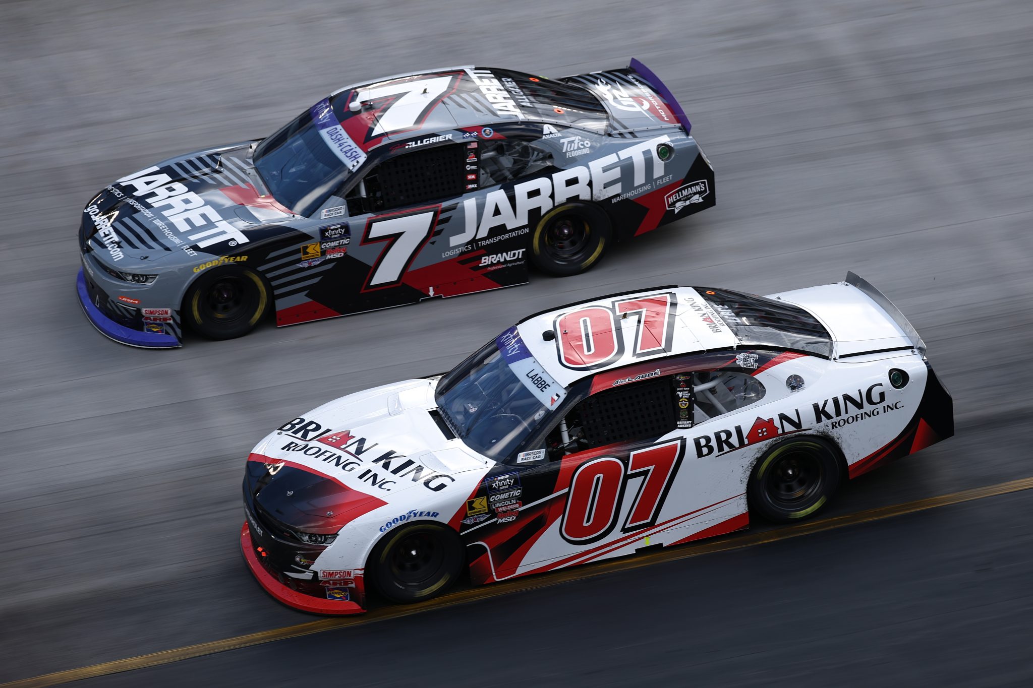 BRISTOL, TENNESSEE - APRIL 12: Alex Labbe, driver of the #07 Brian King Roofing Chevrolet, races Justin Allgaier, driver of the #7 Jarrett Logistics Chevrolet, during the NASCAR Xfinity Series SciAps 300 at Bristol Motor Speedway on April 12, 2025 in Bristol, Tennessee. (Photo by Jared C. Tilton/Getty Images) | Getty Images