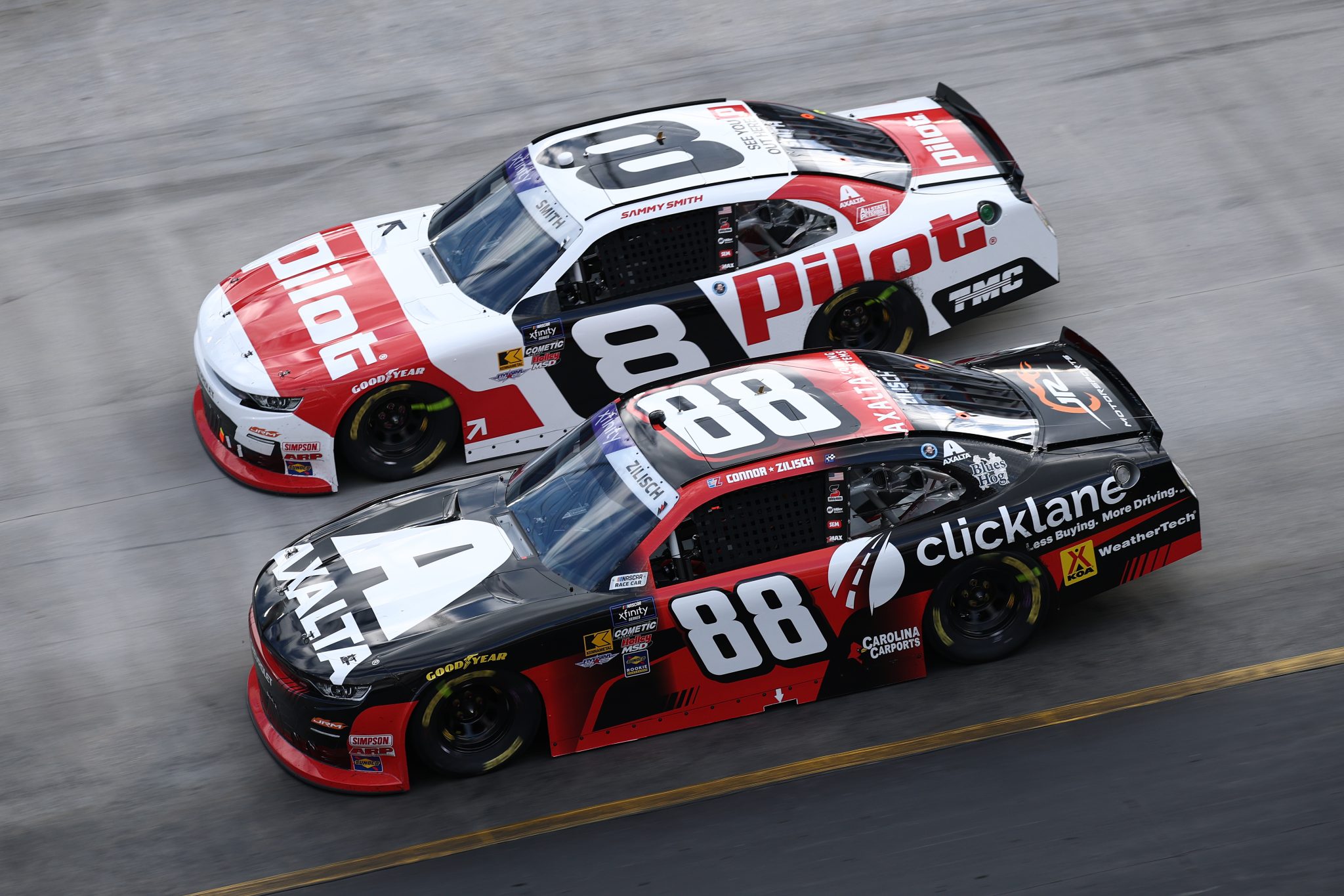 BRISTOL, TENNESSEE - APRIL 12: Sammy Smith, driver of the #8 Pilot Chevrolet, races Connor Zilisch, driver of the #88 Axalta/clicklane Chevrolet, during the NASCAR Xfinity Series SciAps 300 at Bristol Motor Speedway on April 12, 2025 in Bristol, Tennessee. (Photo by Jared C. Tilton/Getty Images) | Getty Images