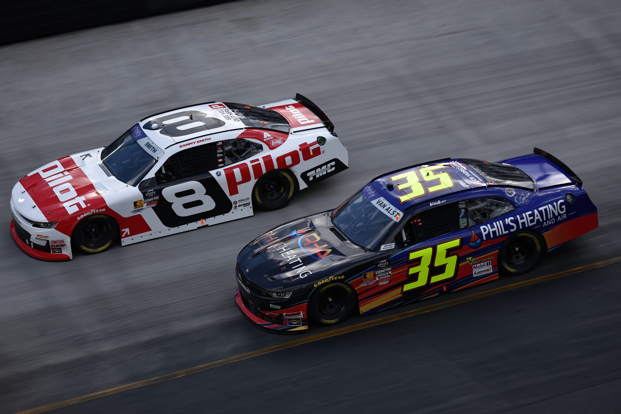 BRISTOL, TENNESSEE - APRIL 12: Sammy Smith, driver of the #8 Pilot Chevrolet, races Greg Van Alst, driver of the #35 Phil's Heating and Air Chevrolet, during the NASCAR Xfinity Series SciAps 300 at Bristol Motor Speedway on April 12, 2025 in Bristol, Tennessee. (Photo by Jared C. Tilton/Getty Images) | Getty Images