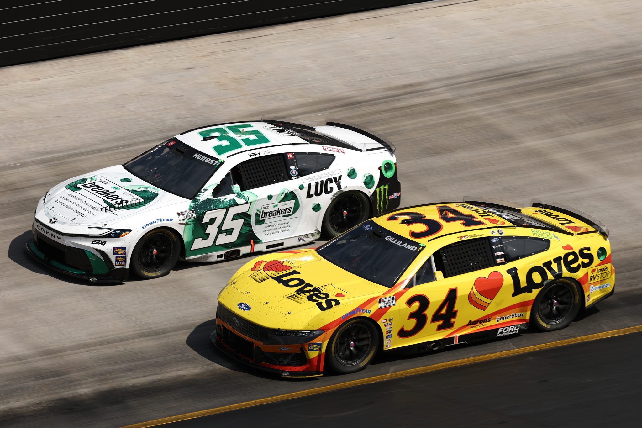 BRISTOL, TENNESSEE - APRIL 13: Todd Gilliland, driver of the #34 Love's Travel Stops Ford, races Riley Herbst, driver of the #35 Lucy Toyota, during the NASCAR Cup Series Food City 500 at Bristol Motor Speedway on April 13, 2025 in Bristol, Tennessee. (Photo by Jared C. Tilton/Getty Images) | Getty Images
