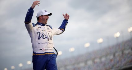 DAYTONA BEACH, FLORIDA - AUGUST 23: Jordan Anderson, driver of the #32 Volpi Foods Chevrolet, waves to fans as he walks onstage during driver intros prior to  the NASCAR Xfinity Series Wawa 250 Powered by Coca-Cola at Daytona International Speedway on August 23, 2024 in Daytona Beach, Florida. (Photo by James Gilbert/Getty Images) | Getty Images
