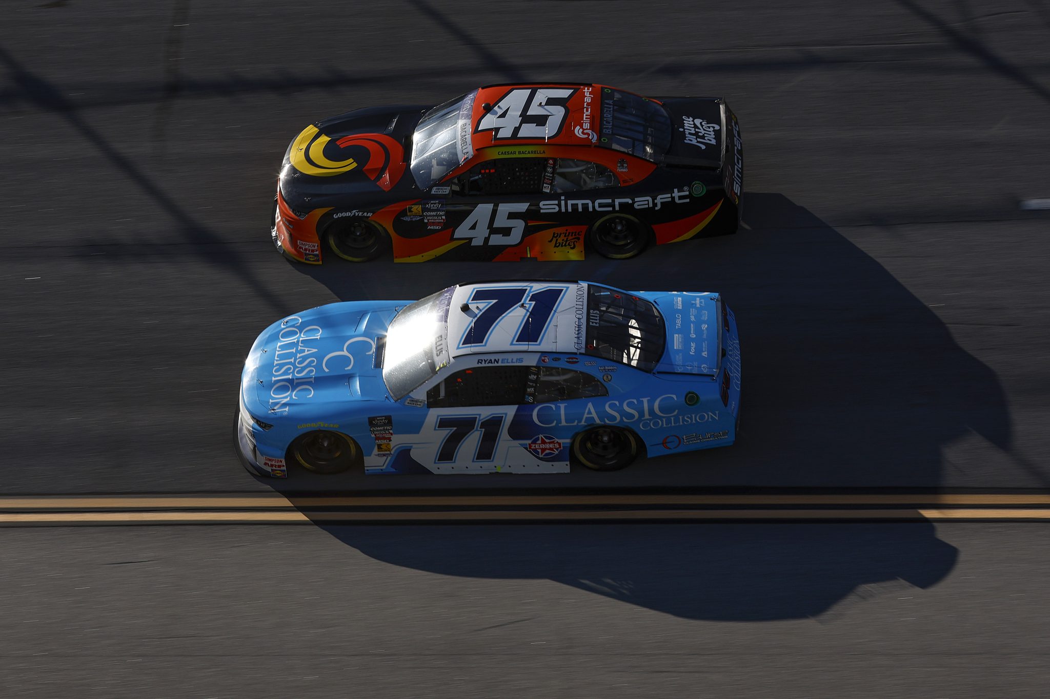 TALLADEGA, ALABAMA - APRIL 26: Ryan Ellis, driver of the #71 Classic Collision Chevrolet, and Caesar Bacarella, driver of the #45 Simcraft Chevrolet, race during the NASCAR Xfinity Series Ag-Pro 300 at Talladega Superspeedway on April 26, 2025 in Talladega, Alabama. (Photo by Sean Gardner/Getty Images) | Getty Images